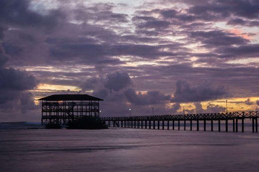 Sunrise over the rebuilt Cloud 9 boardwalk and tower, General Luna, Siargao